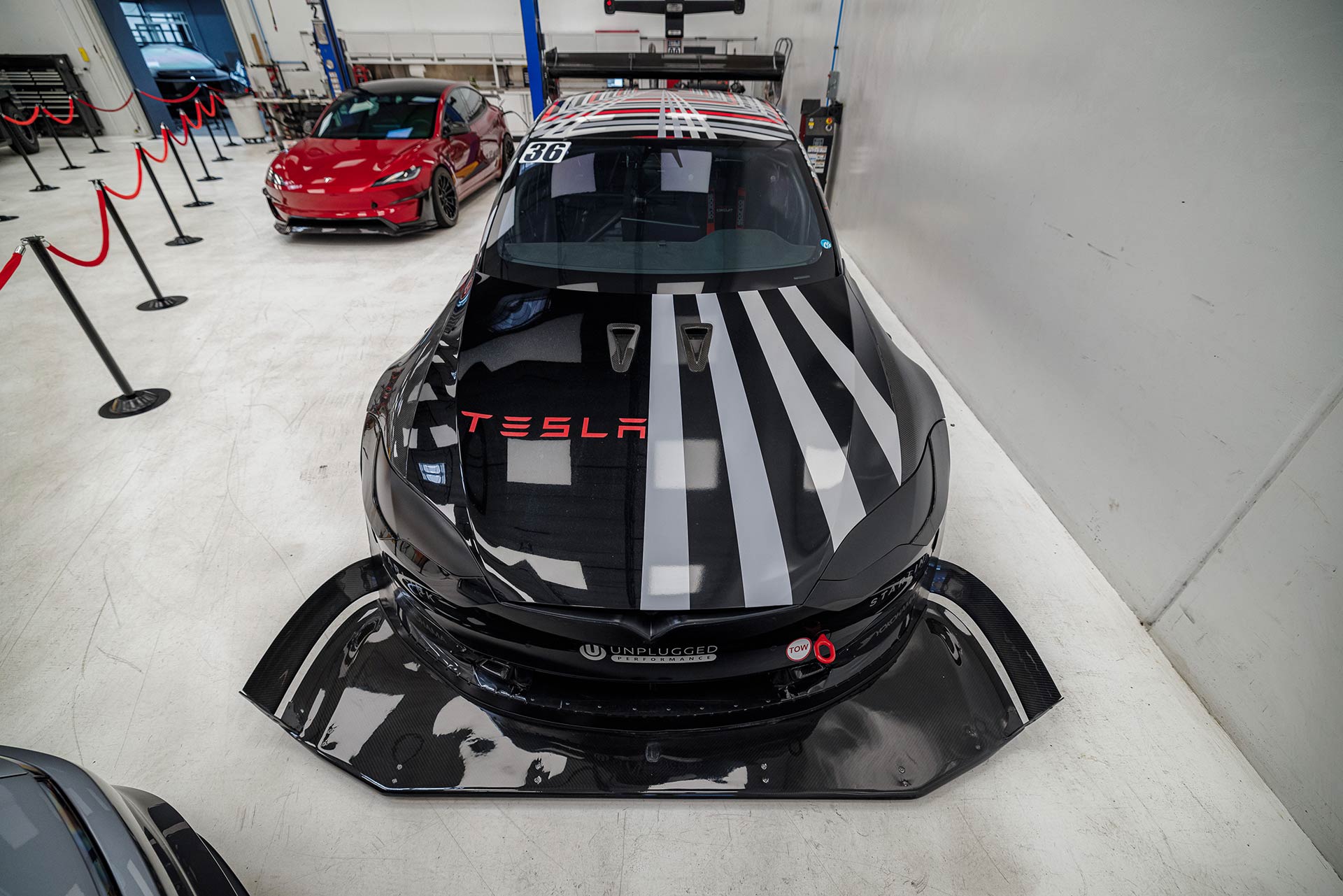Welcoming Hundreds of Tesla Enthusiasts to Experience the Future of Tesla Customization 15 Dark Helmet displayed at Unplugged Performance technical center for Open House Event.