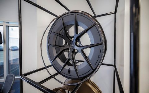 Welcoming Hundreds of Tesla Enthusiasts to Experience the Future of Tesla Customization 19 Unplugged Performance wheels display showcase for guests to view and learn more about.